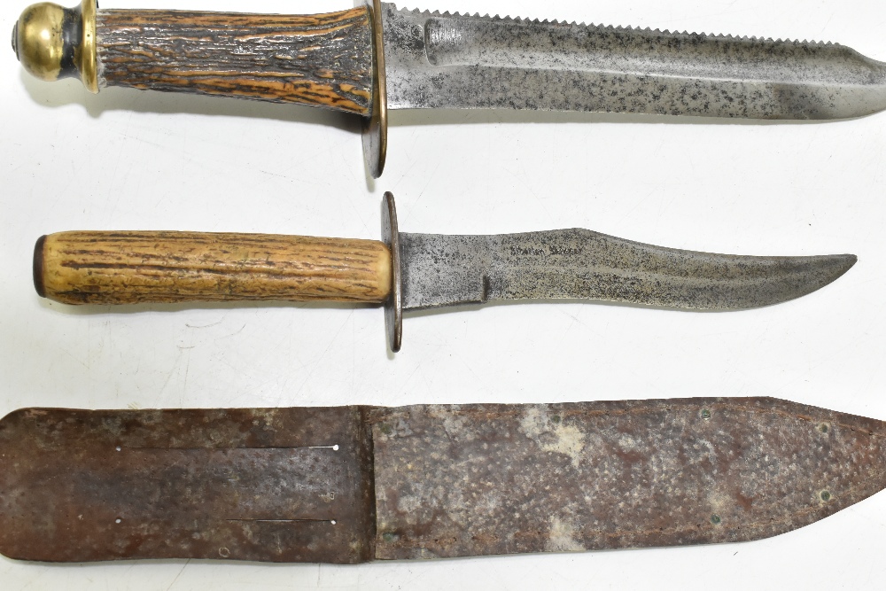 Four knives/daggers, the largest a sawback example with stamped marks to blade base, the brass guard - Image 3 of 11