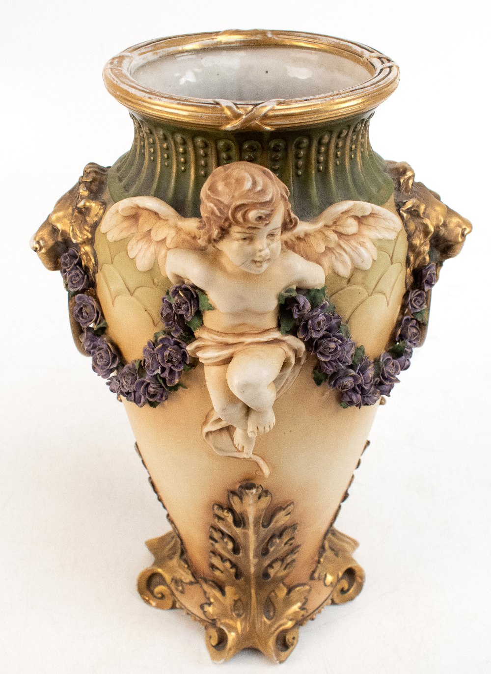 AMPHORA; an Austrian bisque porcelain vase of tapered form with applied winged cherub, moulded