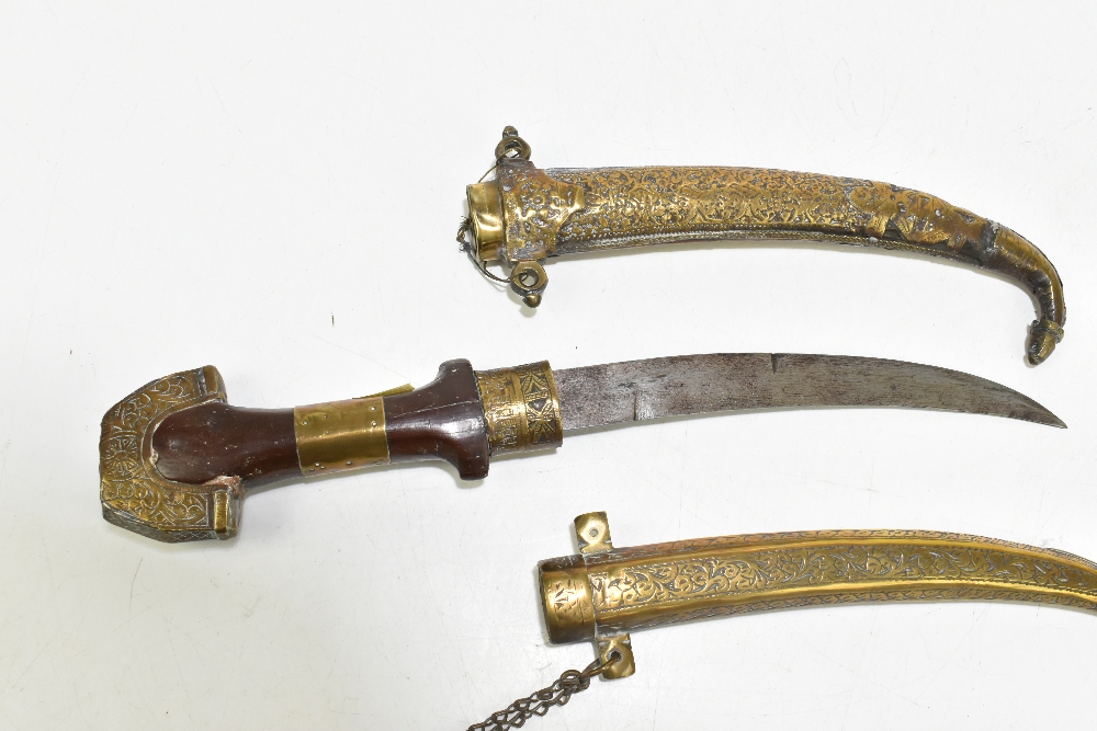 Two North East African/Middle Eastern jambiyas of typical form, both with brass scabbards, length of - Image 4 of 8