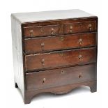 A Georgian oak chest of two short over three long drawers, raised on bracket feet, length 88cm,