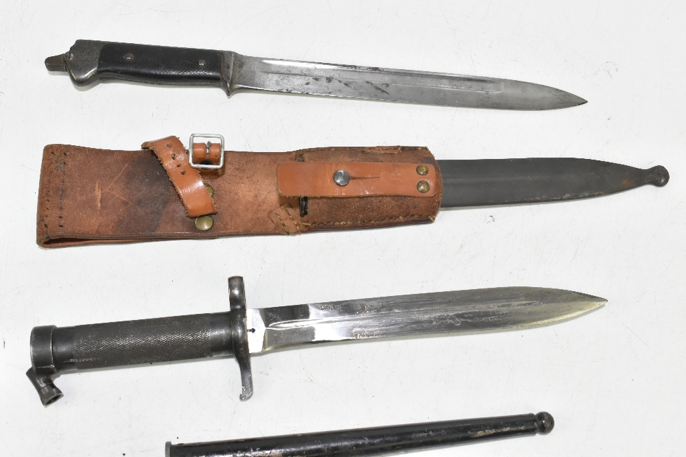 Four bayonets including two German and a socket example, two with scabbards and frogs, the two - Image 3 of 6