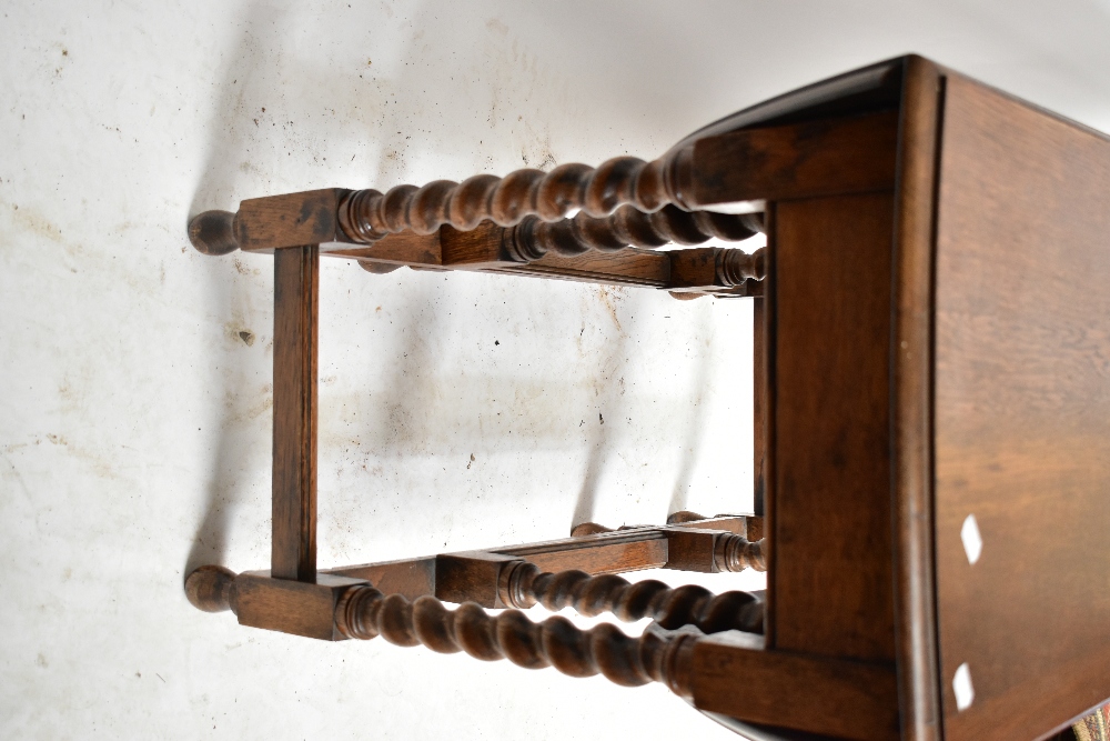 A 1920s oak dropleaf gateleg dining table, raised on barleytwist supports, height 73cm, length 88cm. - Image 2 of 4