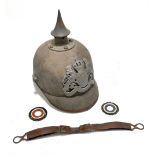 A late 19th/early 20th century German Imperial pickelhaube in green felt with two rosettes, chin