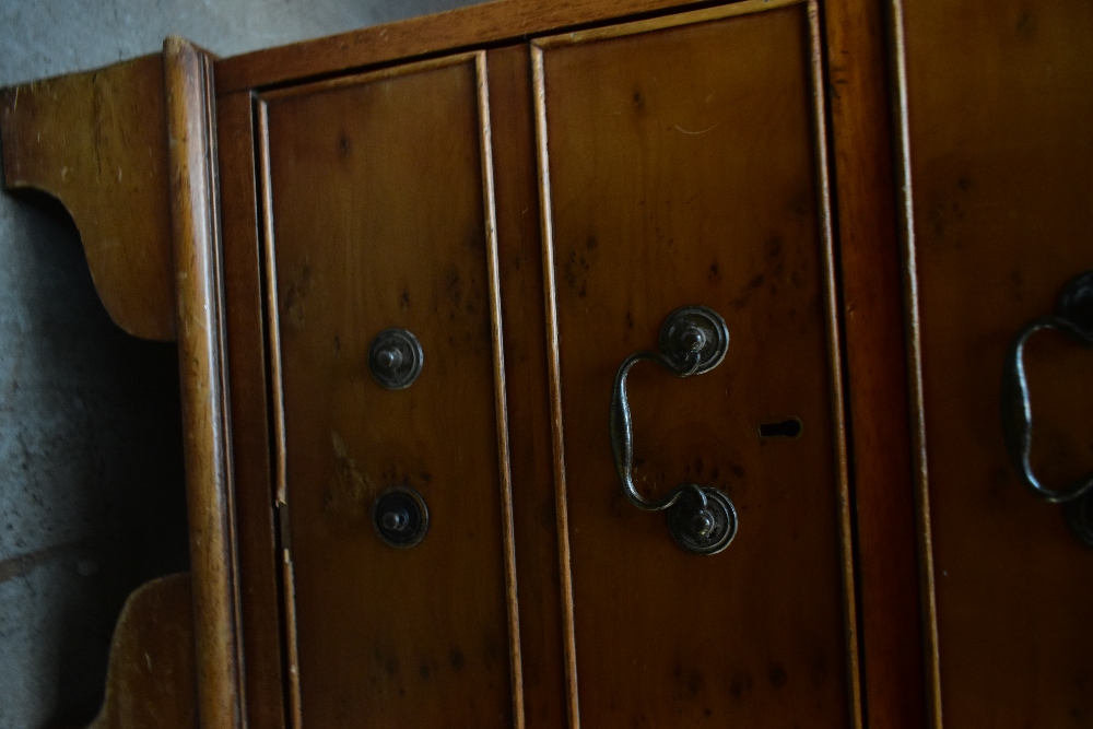 A reproduction yew wood pedestal desk, with green leather inset top above an arrangement of nine - Image 5 of 7