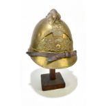 A French fireman's brass helmet with applied badge inscribed 'Sapeurs Pompiers De Neuille Le L.',