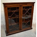 A Victorian mahogany bookcase, the pair of astragal glazed doors enclosing adjustable shelves,