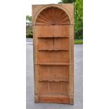 A late 18th/early 19th century old pine freestanding corner cupboard, with carved open shell