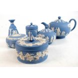 WEDGWOOD; thirty-six pieces of blue jasperware, including two teapots, large trumpet vase,