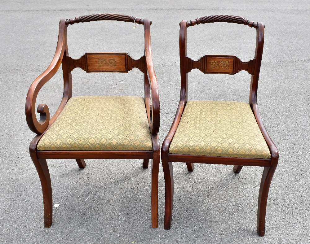 A set of eight reproduction Regency style mahogany rope back dining chairs with brass inlaid