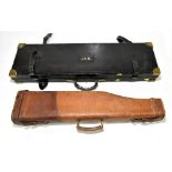 A leather and brass bound shotgun case with gilt tooled initials 'J.A.N.' and blue velvet lined
