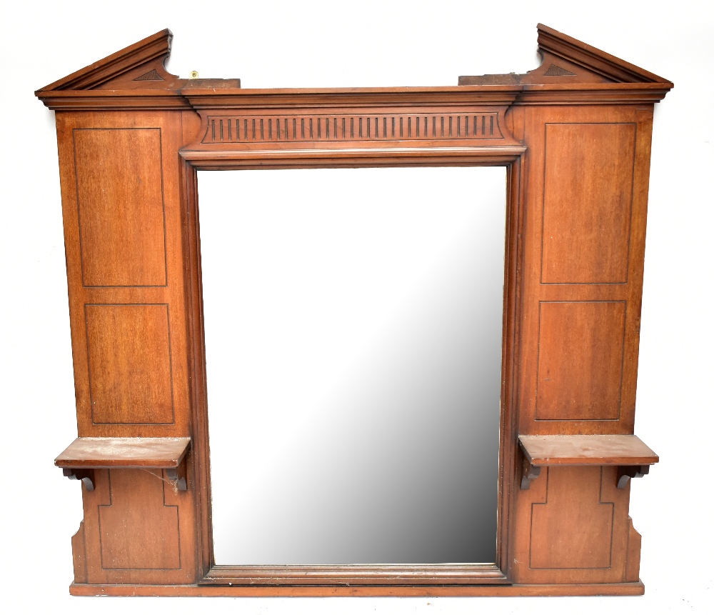 A late Victorian mahogany framed overmantel mirror, the central bevelled plate flanked by two