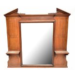 A late Victorian mahogany framed overmantel mirror, the central bevelled plate flanked by two