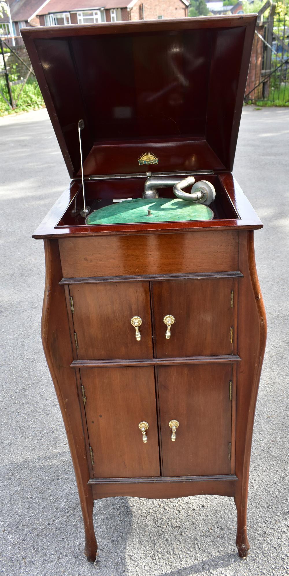 STERNO; an early 20th century mahogany gramophone cabinet, the hinged cover enclosing gramophone