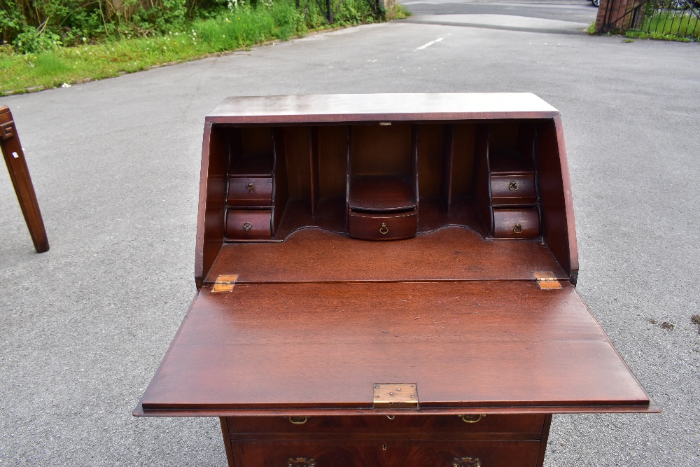 A reproduction mahogany veneered bureau, the fall front above four drawers, raised on bracket - Image 3 of 4