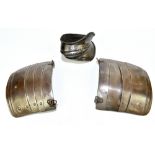 A pair of articulated steel pauldrons, 18.8 x 23.8cm, and an elbow guard (3). Provenance: The