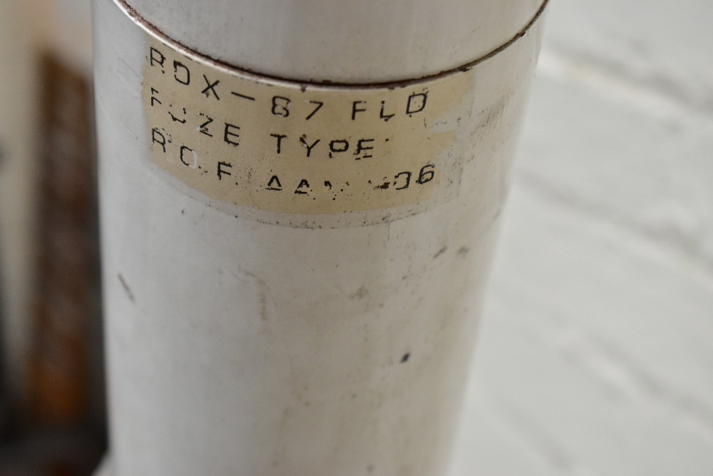 A painted metal model rocket/missile bearing various labels, length 136cm, with stand. Provenance: - Image 2 of 5