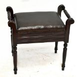 An Edwardian stained beech piano stool with twin handles and hinged seat on turned legs, height