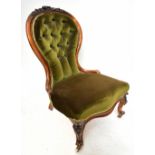 A Victorian walnut spoon back chair of serpentine outline on cabriole front supports to castors.