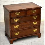 A George III style oak chest of small proportions with two short over four graduated long drawers,