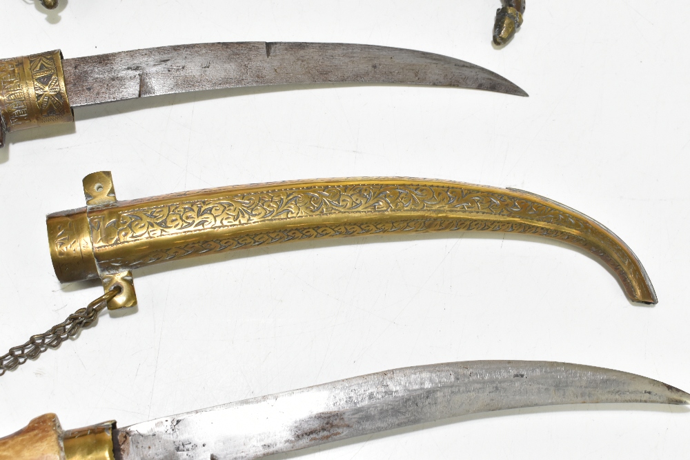 Two North East African/Middle Eastern jambiyas of typical form, both with brass scabbards, length of - Image 3 of 8