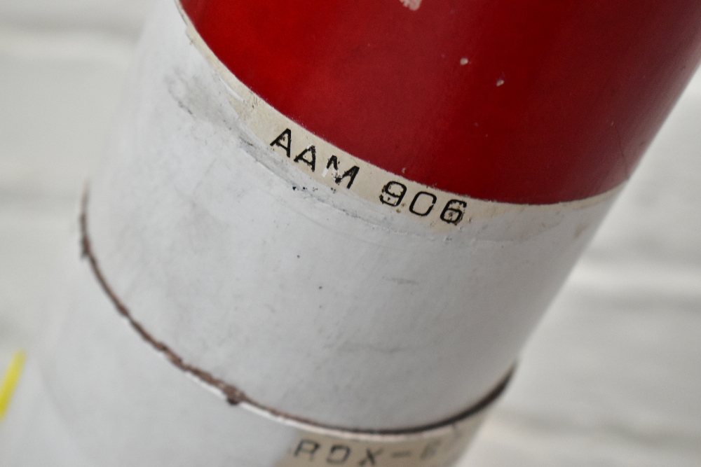 A painted metal model rocket/missile bearing various labels, length 136cm, with stand. Provenance: - Image 3 of 5