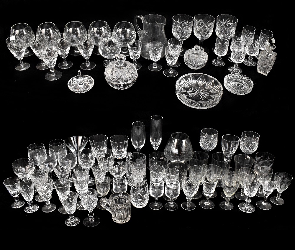 A quantity of assorted cut and pressed glassware to include rummers, assorted drinking glasses,