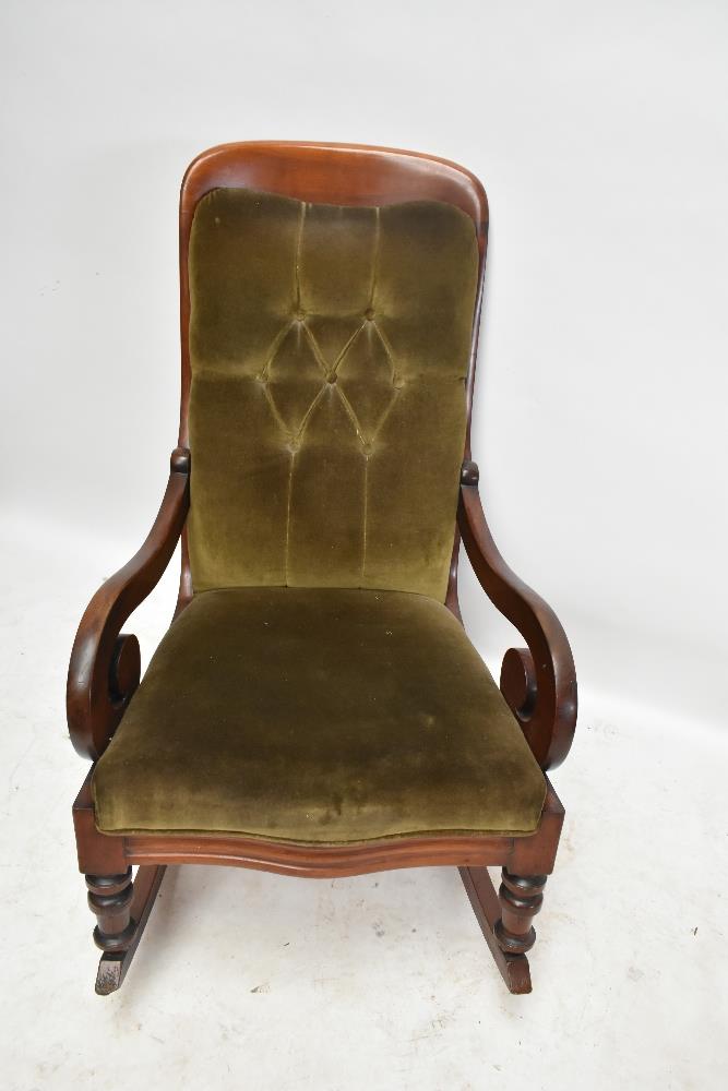 A rocking chair of serpentine outline with scroll arms on turned supports.Additional InformationSome - Image 2 of 4