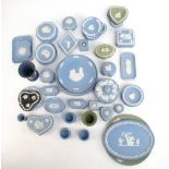 WEDGWOOD; fifty-seven pieces of jasperware including oval plates, trinket boxes, vases, etc.