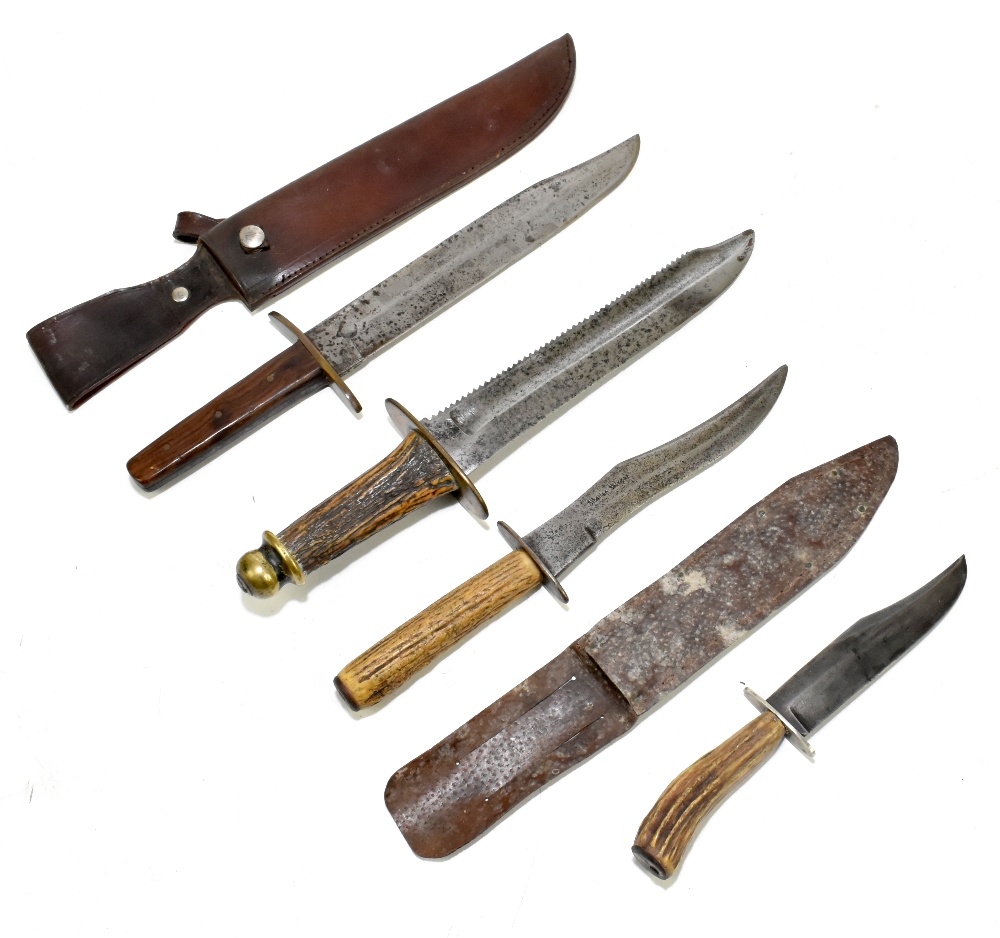 Four knives/daggers, the largest a sawback example with stamped marks to blade base, the brass guard