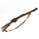 LEE ENFIELD; a .303 bolt action fully stocked rifle, the back strap stamped with a crown cipher