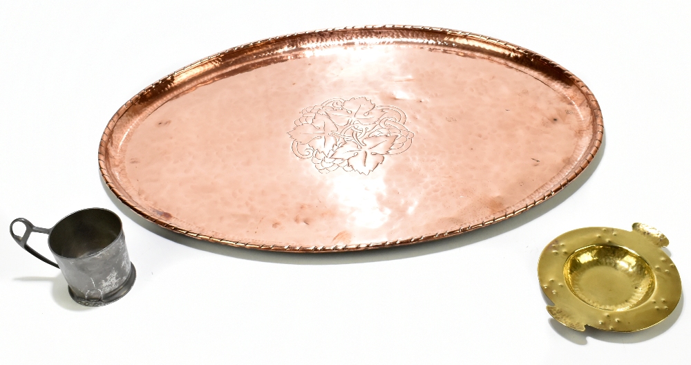 HUGH WALLACE; an Arts & Crafts oval copper tray, engraved with a central fruiting vine motif,