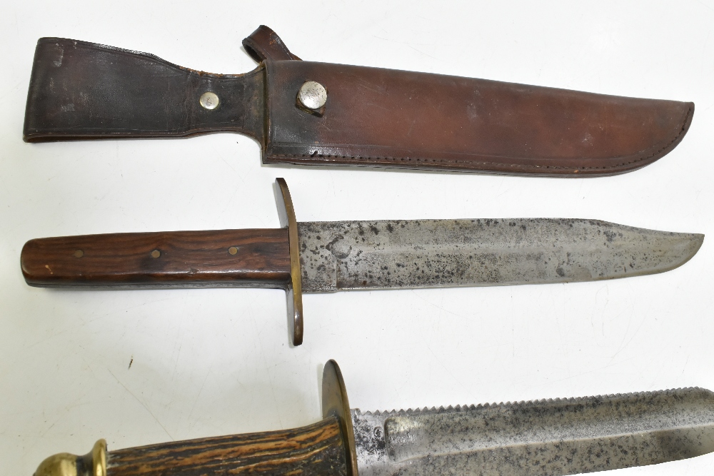 Four knives/daggers, the largest a sawback example with stamped marks to blade base, the brass guard - Image 5 of 11