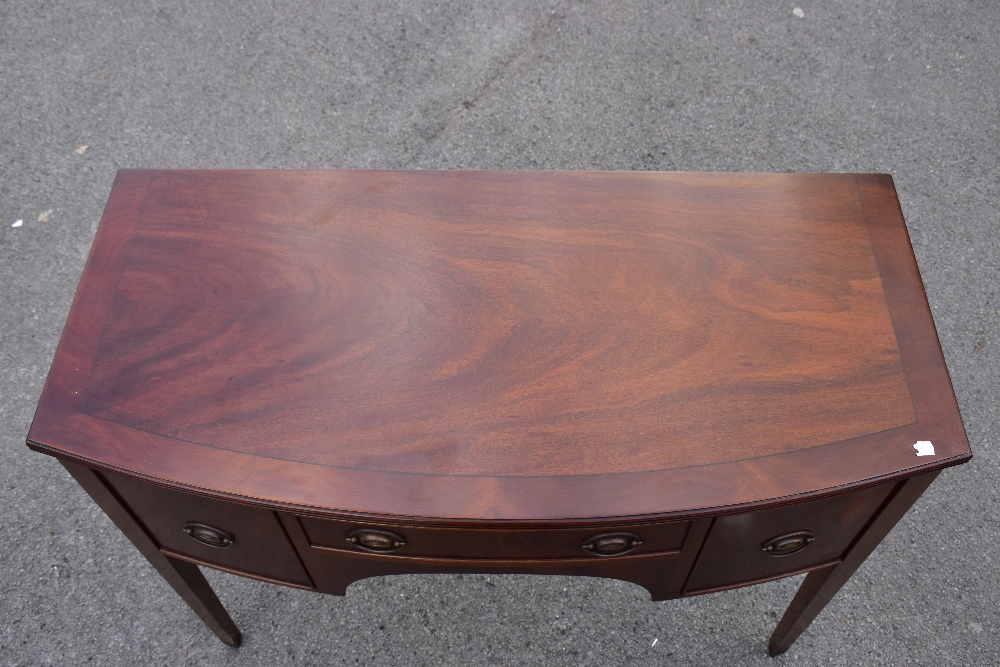 A reproduction mahogany veneered George III style side table, with three oak lined drawers, raised - Image 2 of 4