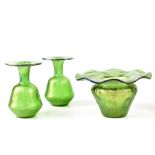 A pair of inverted goblet shaped Loetz iridescent green glass vases,