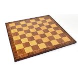 A wooden chessboard, 48 x 48cm.