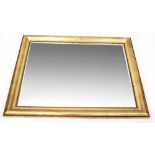 A large gilt framed rectangular bevel-edged wall mirror with bead decoration to the frame,