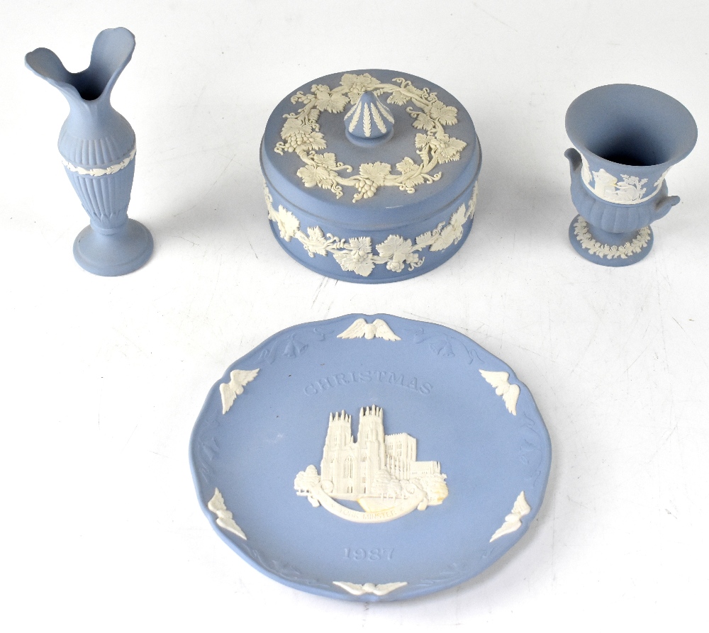 A good collection of Wedgwood eggshell blue jasper ware to include a pair of short candlesticks,