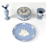 A good collection of Wedgwood eggshell blue jasper ware to include a pair of short candlesticks,