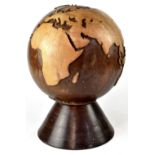 A carved wooden globe on a separate turned stand, total height 40cm.