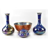 A pair of Crown Devon Fieldings lustre ware vases with slender necks and blue ground decorated with