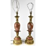 A pair of Neo-Classical style pink onyx and gilt metal mounted table lamps, height 65cm (2).