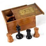 A boxed set of Jaques Staunton chessmen with red crown marks.