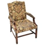 A 19th century mahogany open elbow chair upholstered in a studded tapestry fabric,