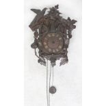 An early 20th century Black Forest cuckoo clock, the dial set with Roman numerals, height 38cm.