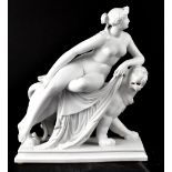 A Parian ware figure of a prowling wildcat with reclining nude young female figure,