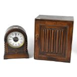 A 1930s oak cased mantel clock, the silvered dial set with Arabic numerals,