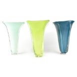 Six contemporary coloured glass lamp shades in form of floral trumpets, height 35cm (6).