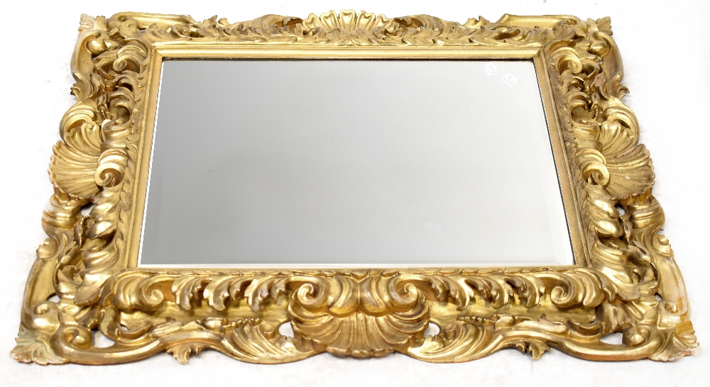 A bevel-edged mirror with scroll, shell and acanthus leaf heavy frame, 95 x 78cm,