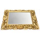 A bevel-edged mirror with scroll, shell and acanthus leaf heavy frame, 95 x 78cm,