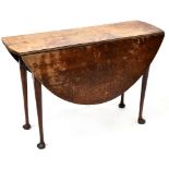 A George III oval top drop-leaf side supper table, on turned tapering legs with pad feet,